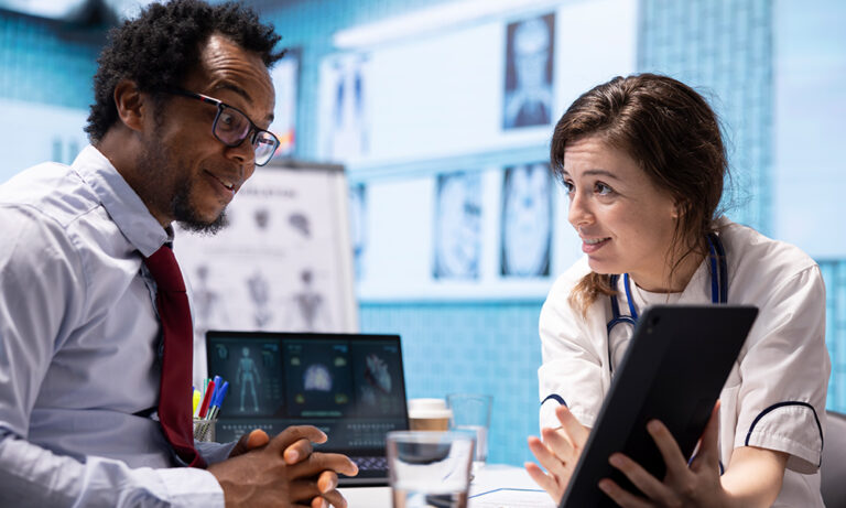 Clinician and patient using an eCOA tablet system to enhance patient experience and improve clinical data quality in trials.