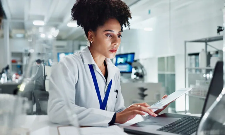 Researcher preparing a Clinical Study Report (CSR) using digital tools to ensure accuracy, transparency, and regulatory compliance