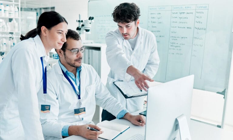 Clinical data team reviewing AI-enabled EDC workflows for clinical trial data management and study review.